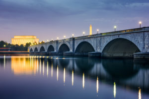 Washington DC, USA skyline on the Potomac River with Lincoln Memorial, Washington Memorial, and Arlington Memorial Bridge.